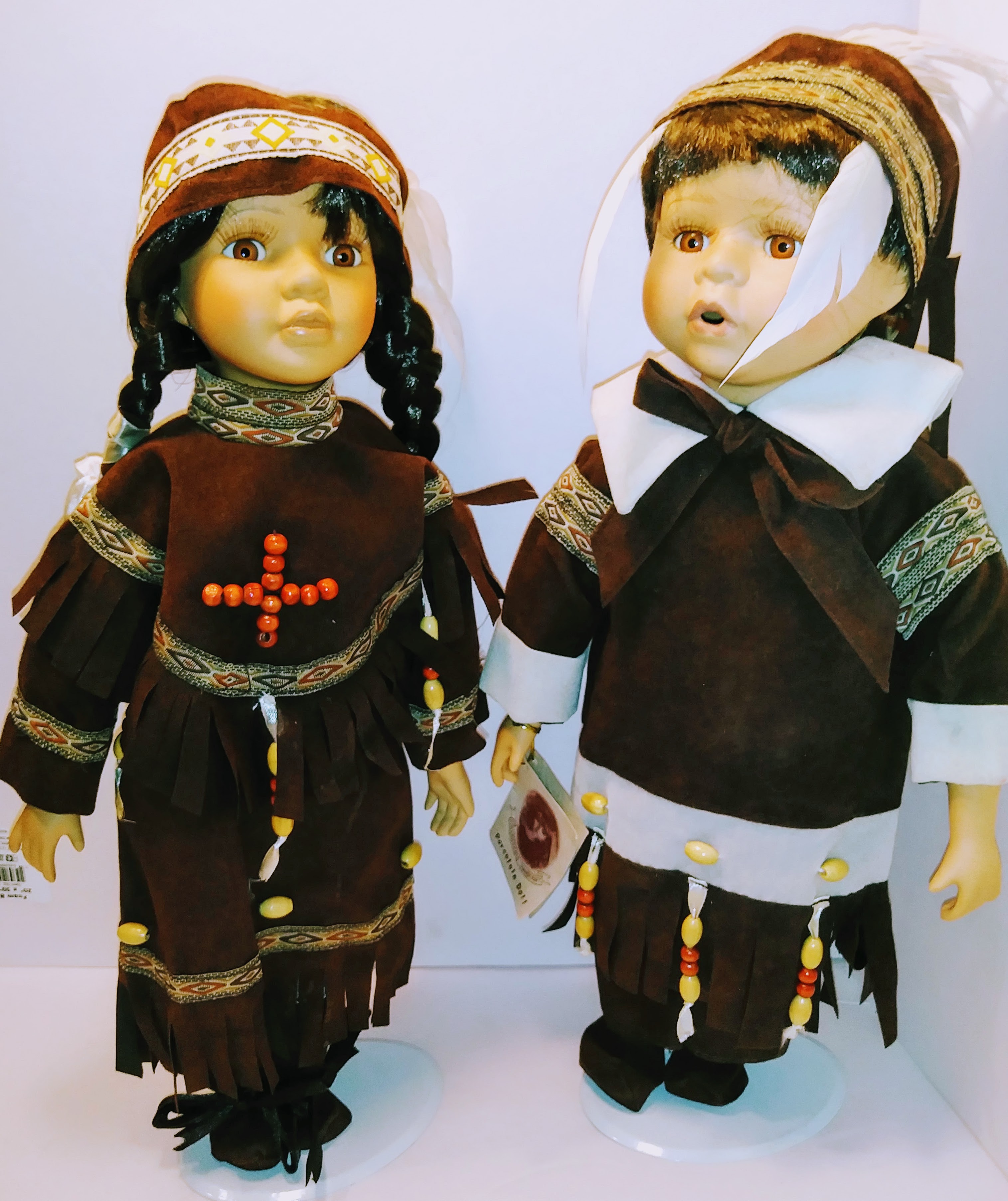 Pair of Native American Themed Porcelain Dolls
